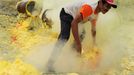 This photo taken on December 25, 2010 shows an Indonesian miner extracting blocks of sulphur with his bare hands from the bottom of the crater of Indonesia's active Kajah