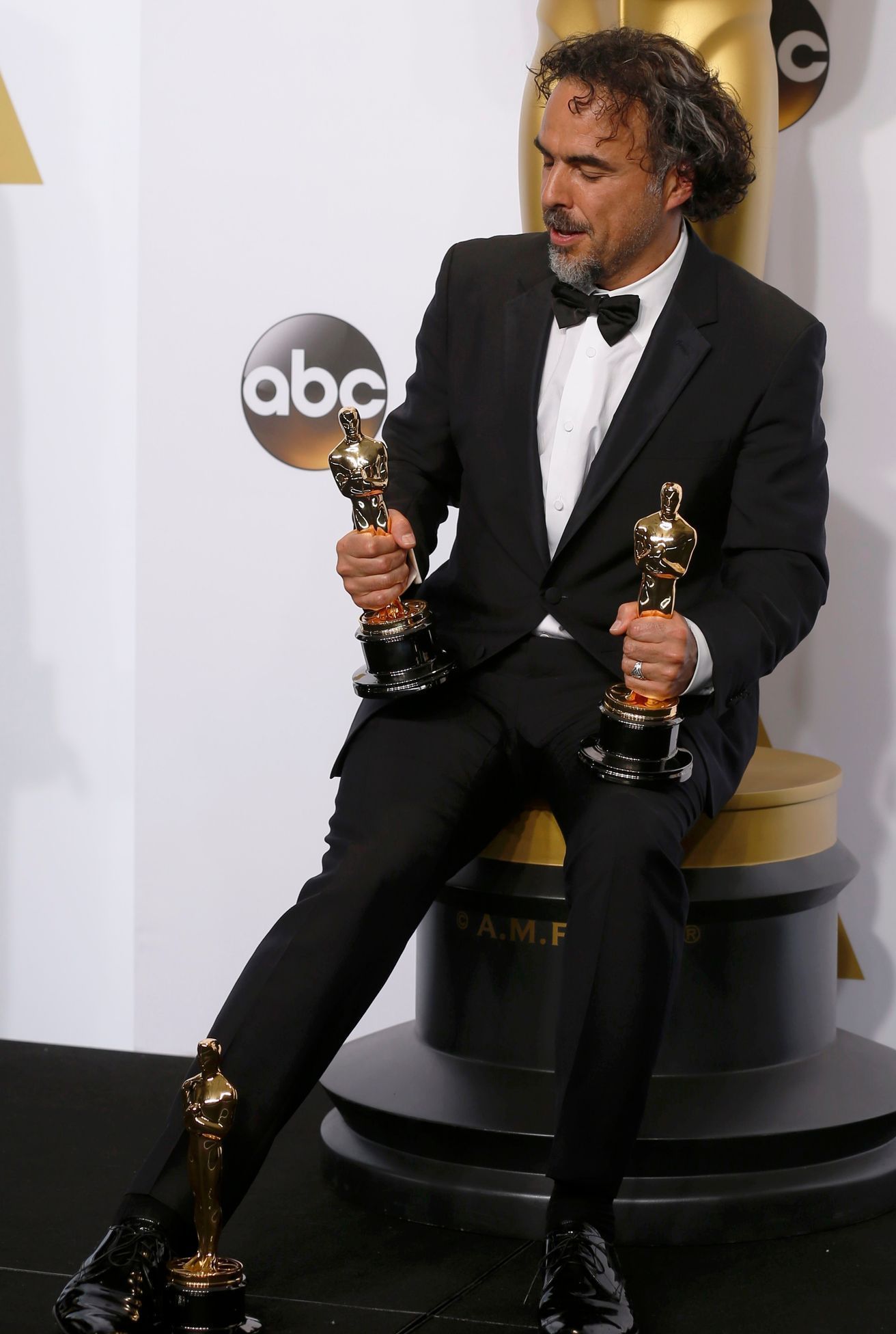 Director Alejandro Inarritu poses with his three Oscars for his film &quot;Birdman&quot; at the 87th Academy Awards in Hollywood