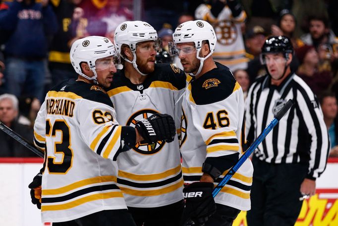 Oct 10, 2019; Denver, CO, USA; Boston Bruins right wing David Pastrňák (88) celebrates his goal with left wing Brad Marchand (63) and center David Krejčí (46) in the firs