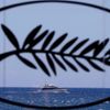 A yacht is seen in the Bay of Cannes through a Palme d'Or symbol on the eve of the opening of the 67th Cannes Film Festival in Cannes