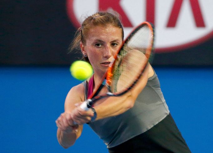 Annika Beck of Germany hits a return to Ana Ivanovic of Serbia during their women's singles match at the Australian Open 2014 tennis tournament in Melbourne January 15, 2