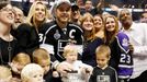 Los Angeles Kings' Dustin Brown puts his daughter Mackenzie in the Stanley Cup after the Kings' defeated the New York Rangers in Game 5 of their NHL Stanley Cup Finals ho