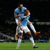 Manchester City's Kompany celebrates with teammate Negredo after scoring a goal against Liverpool during their English Premier League soccer match in Manchester
