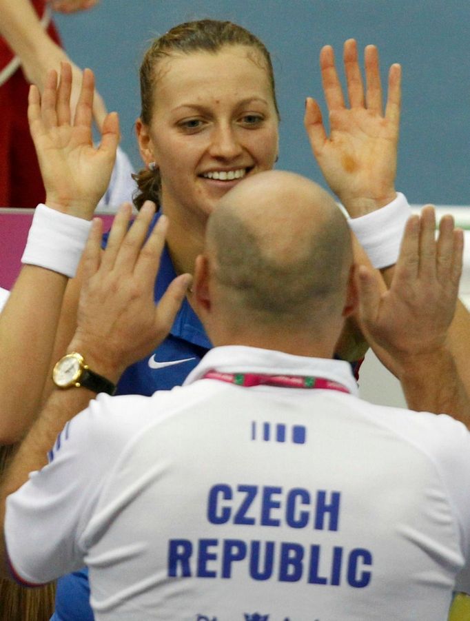 Česká tenistka Petra Kvitová slaví vítězství ve finále Fed Cupu 2011 proti Rusku.