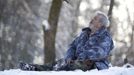 Wolf researcher Werner Freund howls while sitting in an enclosure for Arctic wolves at Wolfspark Werner Freund, in Merzig in the German province of Saarland January 24, 2013. Freund, 79, a former German paratrooper, established the wolf sanctuary in 1972 and has raised more than 70 animals over the last 40 years. The wolves, acquired as cubs from zoos or animal parks, were mostly hand-reared. Spread over 25 acres, Wolfspark is currently home to 29 wolves forming six packs from European, Siberian, Canadian, Artic and Mongolian regions. Werner has to behave as the wolf alpha male of the pack to earn the other wolves respect and to be accepted. Picture taken January 24, 2013. REUTERS/Lisi Niesner (GERMANY - Tags: ANIMALS SOCIETY) Published: Led. 26, 2013, 2:45 odp.