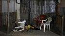 The dead body of a woman who was shot dead by two gunmen on a motorcycle is seen at a crime scene in San Pedro Sula March 20, 2013. San Pedro Sula, the country's second largest city after Tegucigalpa, has a homicide rate of 169 per 100,000 people and was named the world's most violent city for a second year in a row. Lax laws allow civilians to own up to five personal guns. Arms trafficking has flooded the country with nearly 70% illegal firearms. 83.4% of homicides are by firearms, compared to 60% in the United States. Picture taken March 20, 2013. REUTERS/Jorge Cabrera (HONDURAS - Tags: CRIME LAW CIVIL UNREST HEALTH) ATTENTION EDITORS: PICTURE 5 OF 39 FOR PACKAGE 'GUN CULTURE - HONDURAS' SEARCH 'HONDURAS GUN' FOR ALL IMAGES Published: Dub. 5, 2013, 11:14 dop.