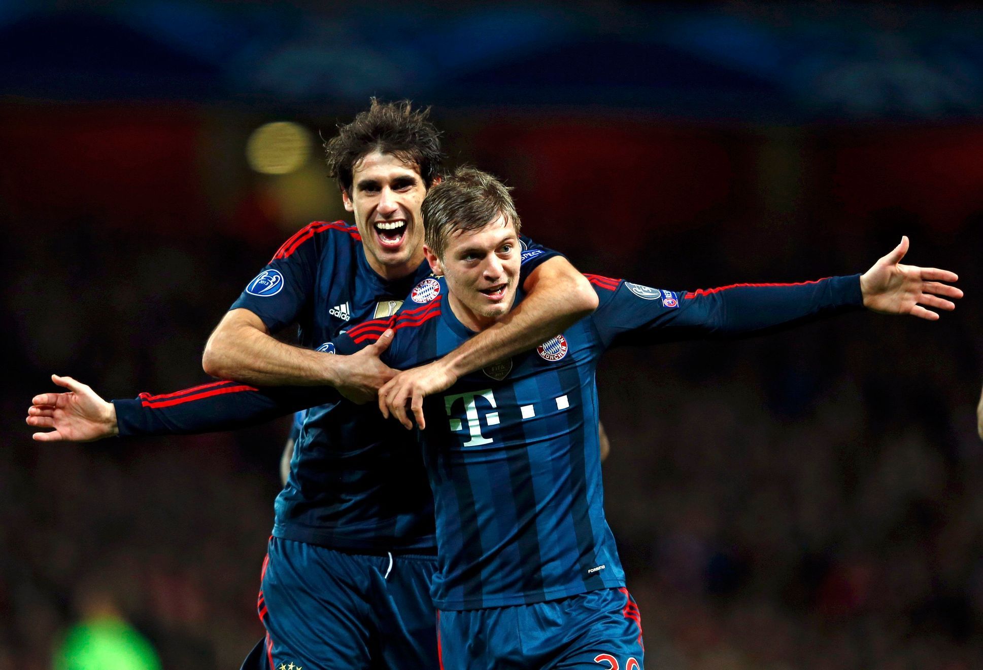 Bayern Munich's Kroos celebrates his goal against Arsenal with team mate Martinez during their Champions League round of 16 first leg soccer match at the Emirates Stadium in London