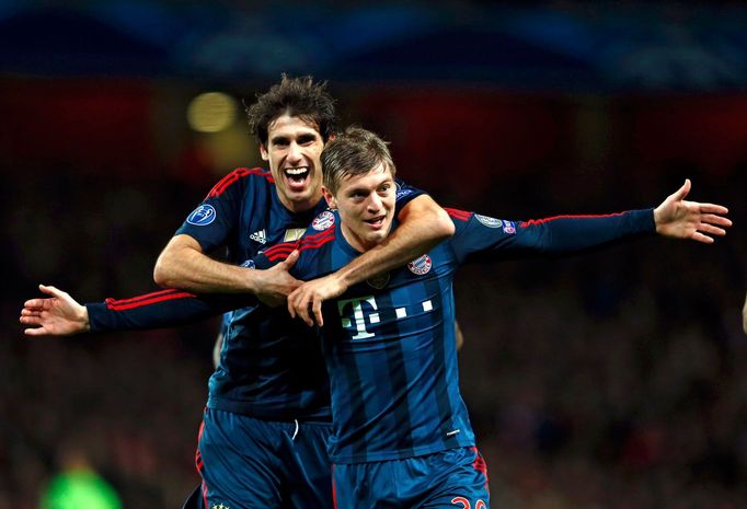 Bayern Munich's Kroos celebrates his goal against Arsenal with team mate Martinez during their Champions League round of 16 first leg soccer match at the Emirates Stadium