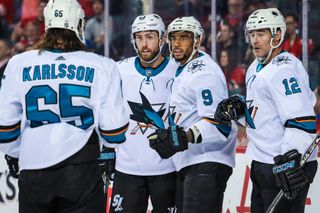 Feb 4, 2020; Calgary, Alberta, CAN; San Jose Sharks left wing Evander Kane (9) celebrates his goal with teammates against the Calgary Flames during the second period at S