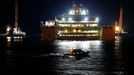 The Costa Concordia cruise liner is seen at Giglio harbour at Giglio Island, late July 17, 2014.