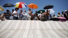 Bosnian Muslims observe a prayer session near a memorial plaque at Memorial Center in Potocari during a mass burial, near Srebrenica July 11, 2012. The bodies of 520 recently identified victims of the Srebrenica massacre is buried on July 11, the anniversary of the massacre when Bosnian Serb forces commanded by Ratko Mladic slaughtered 8,000 Muslim men and boys and buried them in mass graves, in Europe's worst massacre since World War Two. REUTERS/Dado Ruvic (BOSNIA - Tags: CONFLICT OBITUARY ANNIVERSARY TPX IMAGES OF THE DAY)