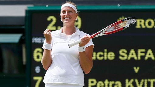 Petra Kvitova of the Czech Republic reacts to defeating Lucie Safarova of the Czech Republic in their women's singles semi-final tennis match at the Wimbledon Tennis Cham