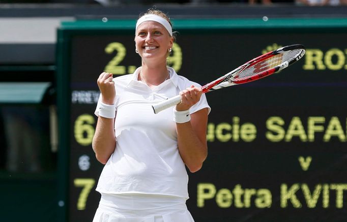 Petra Kvitova of the Czech Republic reacts to defeating Lucie Safarova of the Czech Republic in their women's singles semi-final tennis match at the Wimbledon Tennis Cham