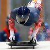 Britain's Bromley speeds down the track during a men's skeleton training session at the Sanki sliding center in Rosa Khutor, a venue for the Sochi 2014 Winter Olympics, near Sochi