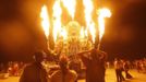 Participants watch the flames from El Pulpo Mecanico during the Burning Man 2012 "Fertility 2.0" arts and music festival in the Black Rock Desert of Nevada August 29, 2012. More than 60,000 people from all over the world have gathered at the sold out festival, which is celebrating its 26th year, to spend a week in the remote desert cut off from much of the outside world to experience art, music and the unique community that develops.