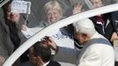 Pope Benedict XVI waves from his Popemobile as he rides through a packed Saint Peter's Square at the Vatican during his last general audience, February 27, 2013. The weekly event which would normally be held in a vast auditorium in winter, but has been moved outdoors to St. Peter's Square so more people can attend. The pope has two days left before he takes the historic step of becoming the first pontiff in some six centuries to step down instead of ruling for life. REUTERS/Tony Gentile (VATICAN - Tags: RELIGION)