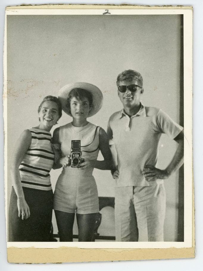 This undated photo provided by John McInnis Auctioneers in Amesbury, Mass., shows late President John F. Kennedy, right, with his wife, Jacqueline, center, and sister-in-law Ethyl Kennedy, left. The photograph is among items to be auctioned Sunday, Feb. 17, 2013. The family of David Powers, a former special assistant to President John F. Kennedy, is auctioning hundreds of photographs, documents, gifts and other memorabilia that once belonged to the late president. (AP Photo/John McInnis Auctioneers)