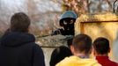 An Ukrainian soldier aims his rifle at pro-Russia protesters gathered in front of a Ukrainian airbase in Kramatorsk, in eastern Ukraine April 15, 2014.