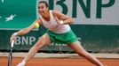 Flavia Pennetta of Italy hits a return to Johanna Larsson of Sweden during their women's singles match at the French Open tennis tournament at the Roland Garros stadium i