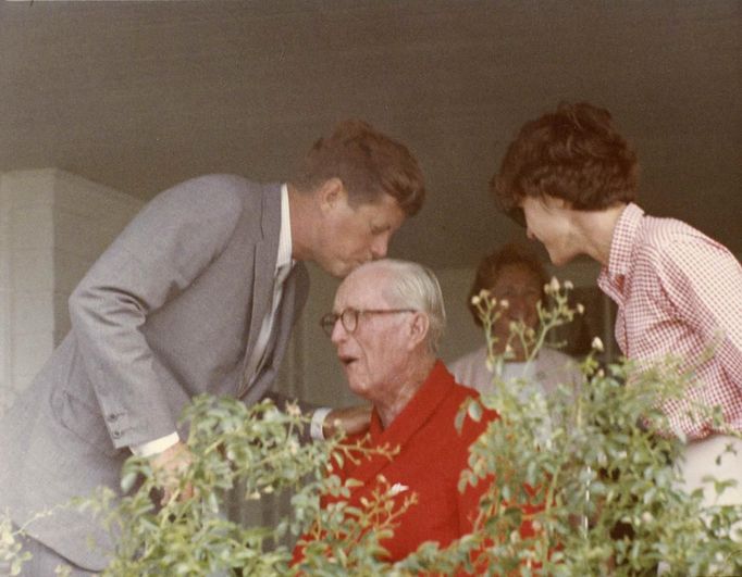 United States President John F. Kennedy (L) kisses his father, then Ambassador Joseph P. Kennedy Sr., before boarding Marine One to depart Hyannis Port, Massachusetts, in this handout image taken on August 3, 1963.