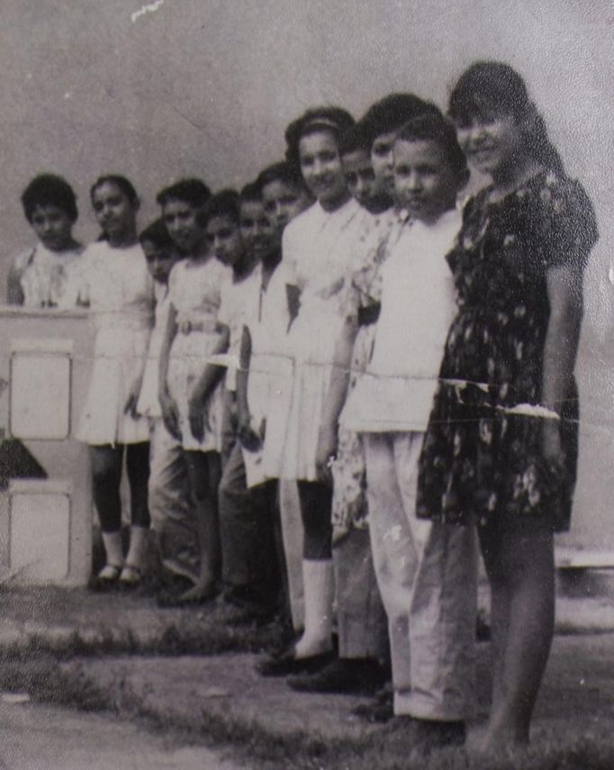 Venezuelan President Hugo Chavez (2nd L) poses with classmates in his hometown of Sabaneta in Barinas, in this undated handout photo provided by his former neighbour Flor Figueredo on July 16, 2011. To understand why President Hugo Chavez may win yet another election in Venezuela next month, go and sit under the mango trees of Los Rastrojos or Sabaneta. There, in the rural villages of his childhood at the heart of Venezuela's great savannah or "llanos", family and friends pour out tales of a boy whose motor-mouth and popular touch - now mainstays of his rule - were evident early on. To match Insight VENEZUELA-ELECTION/CHAVEZ REUTERS/Handout (VENEZUELA - Tags: POLITICS ELECTIONS) NO SALES. NO ARCHIVES. FOR EDITORIAL USE ONLY. NOT FOR SALE FOR MARKETING OR ADVERTISING CAMPAIGNS