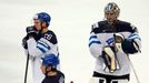 Finland's Jarkko Immonen, Erik Haula and goalie Pekka Rinne (L-R) react after their men's ice hockey World Championship Group B game against the U.S. at Minsk Arena in Mi