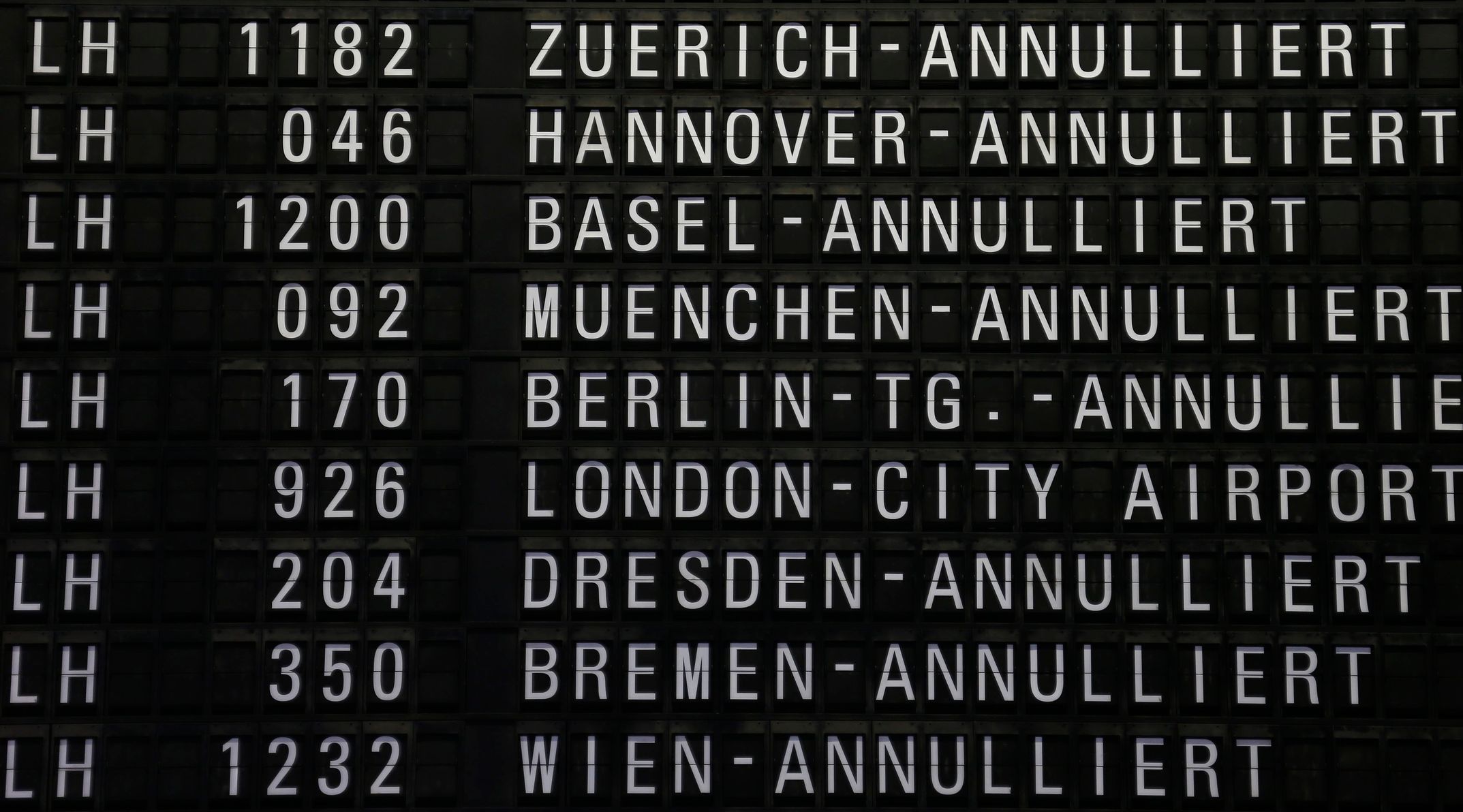 Cancelled flights of German air carrier Lufthansa are seen on a flight schedule board at Fraport airport in Frankfurt