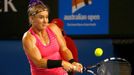 Bethanie Mattek-Sands of the United States hits a return to Maria Sharapova of Russia during their women's singles match at the Australian Open 2014 tennis tournament in