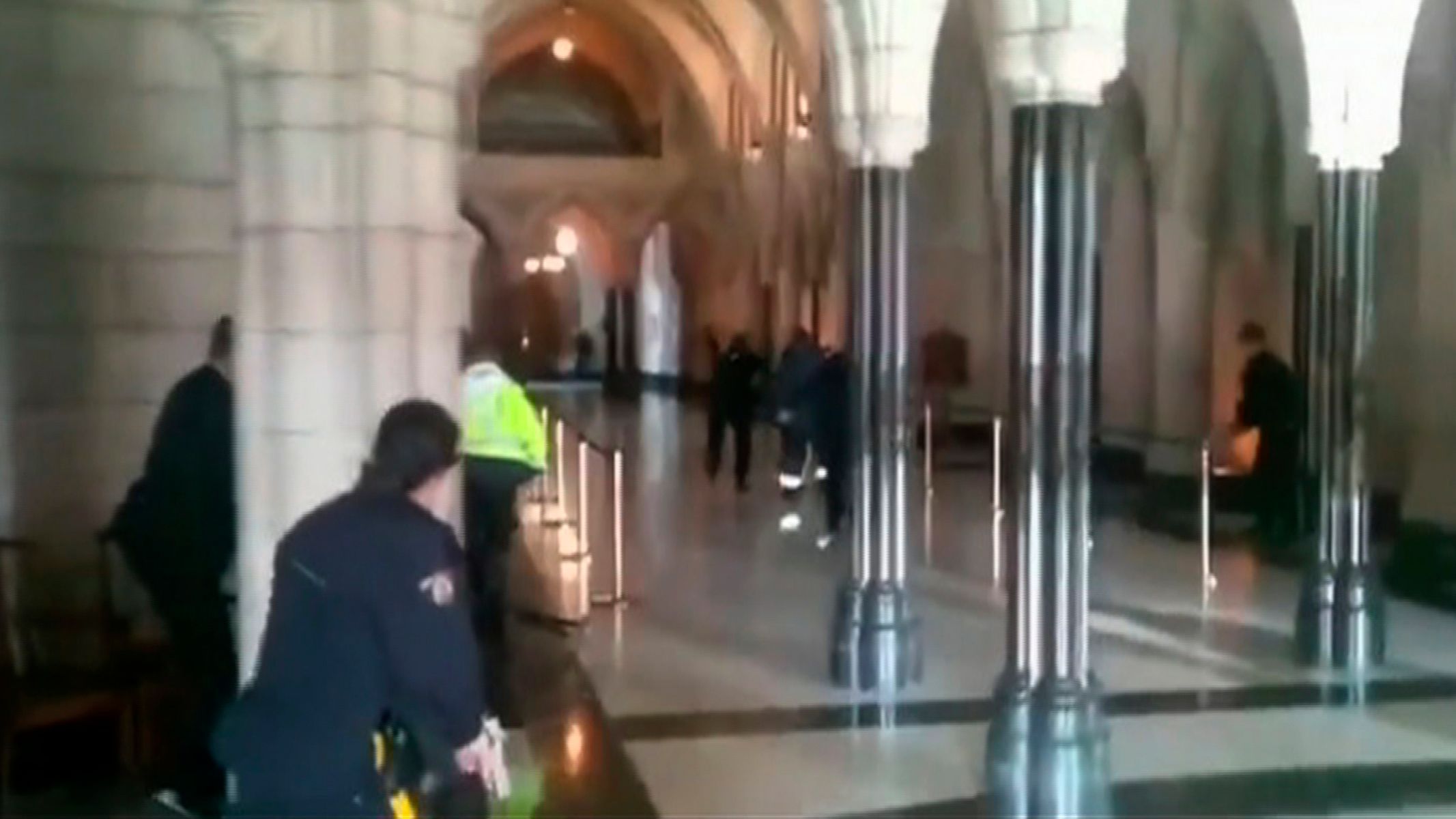 Police officers respond to shooting attacks inside the Centre Block of the Parliament buildings in Ottawa