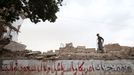 A crippled boy walks on a wall of a house destroyed by a recent Saudi-led air strike in the old quarter of Yemen's capital Sanaa July 14, 2015