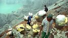 To go with story Indonesia-volcano-mine by Jerome Rivet A picture taken on April 26, 2010 shows Indonesian sulphur miners carrying blocks of sulphur from the caldera (beh