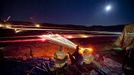 Gun Enthusiasts Gather for Machine Gun Shoot in Rural Arizona 2012-10-19 00:00:00 epa03515002 (21/22) A long exposure image shows visitors to the Big Sandy Machine Gun Shoot firing their machine guns as flares, tracer fire, and the moon light up the night sky outside Wikieup, Arizona, USA, 19 October 2012. Twice a year, the Big Sandy lures gun enthusiasts to the Sonoran Desert for a weekend of firing heavy weaponry. EPA/JIM LO SCALZO