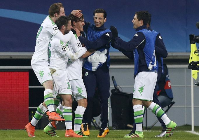 VfL Wolfsburg's Max Kruse celebrates with team mates after scoring against KAA Gent.