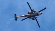 Israeli Apache helicopter flies over Gaza, as seen from Israel