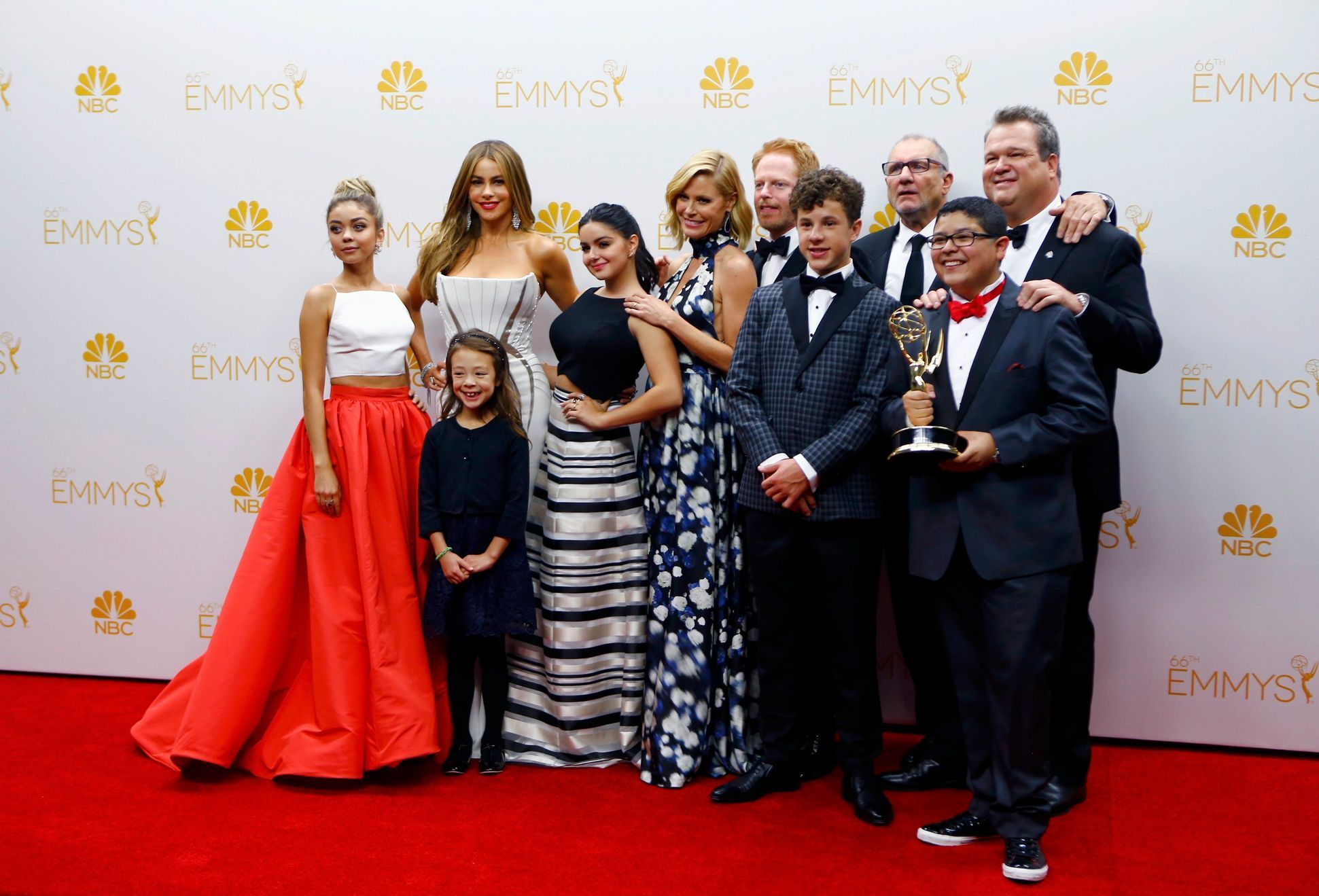 The cast and crew of ABC's &quot;Modern Family&quot; pose with their award for Outstanding Comedy Series at the 66th Primetime Emmy Awards in Los Angeles