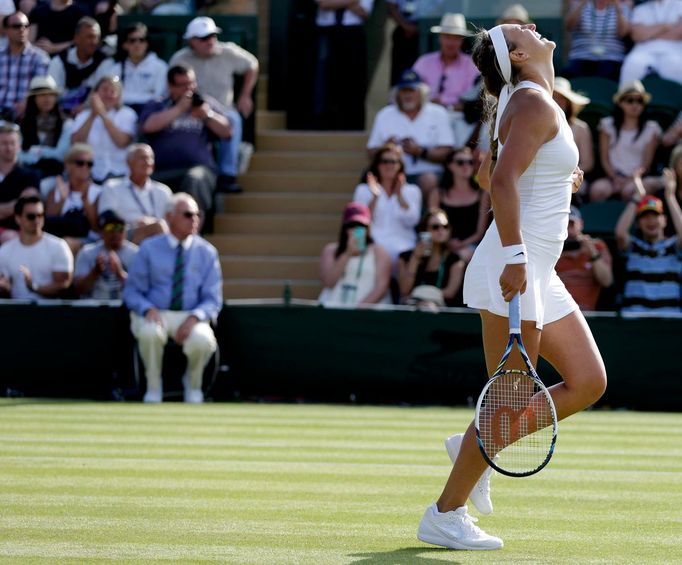 Victoria Azarenka of Belarus celebrates after winning her match against Kristina Mladenovic of France at the Wimbledon Tennis Championships in London