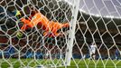 Italy's Salvatore Sirigu dives as he watches a shot by England's Raheem Sterling hit the side netting during their 2014 World Cup Group D soccer match at the Amazonia are