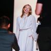 Designer Lubov Azria smiles for photographers before showing the BCBG Max Azria collection during New York Fashion Week