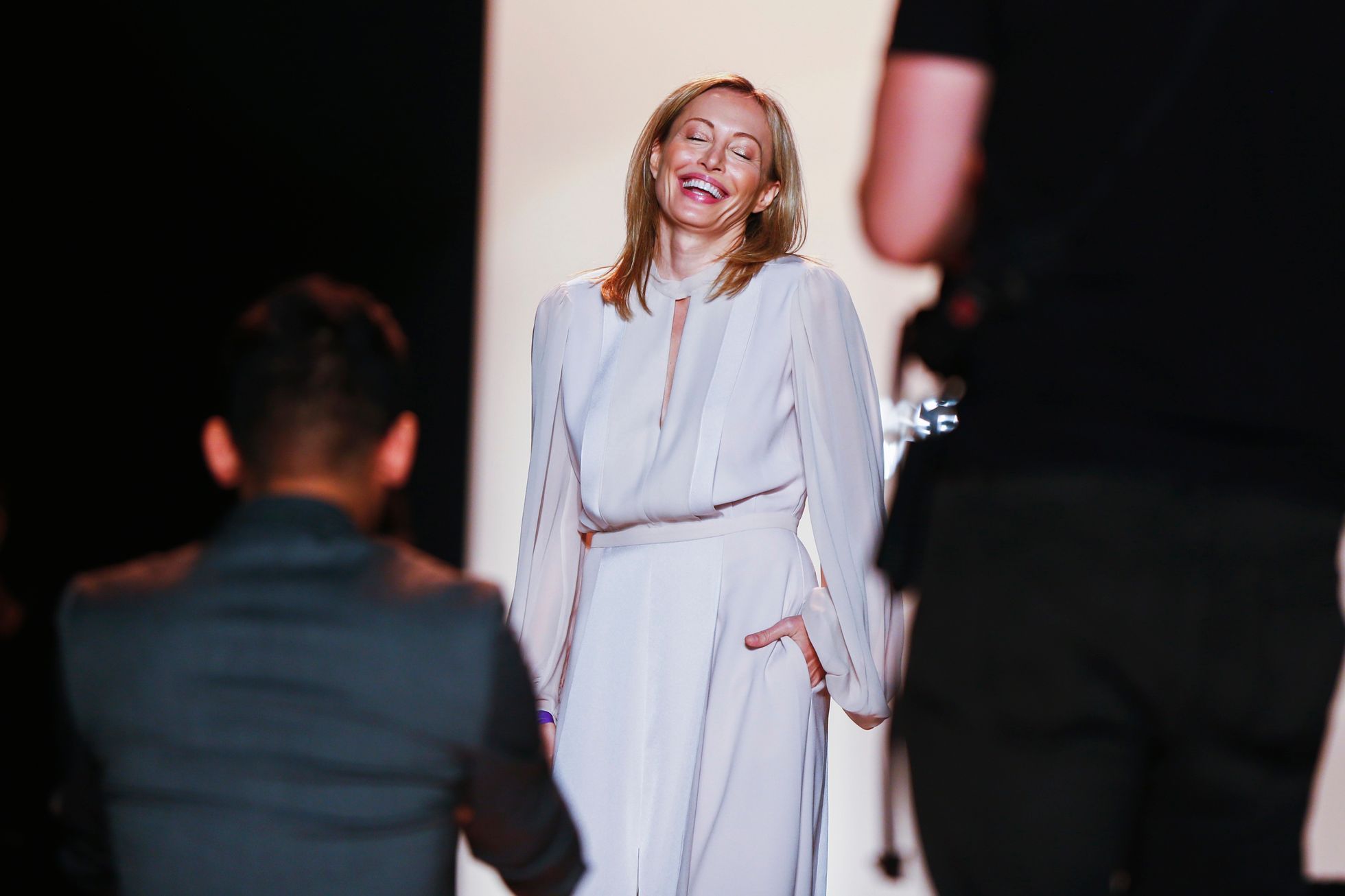 Designer Lubov Azria smiles for photographers before showing the BCBG Max Azria collection during New York Fashion Week