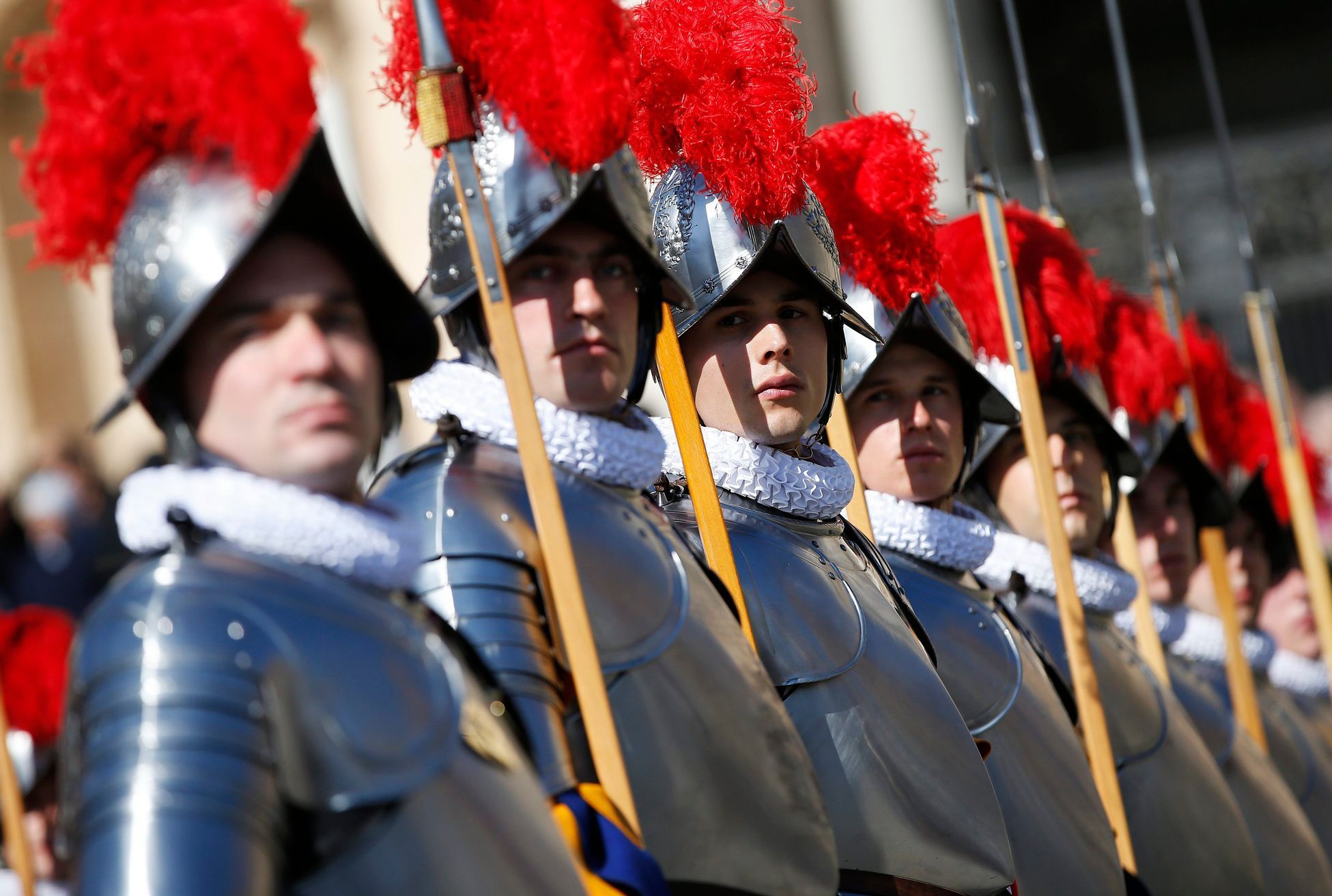 Swiss guards stand to attention before the arrival of Pope Francis to lead the Easter mass in Saint Peter's Square at the Vatican