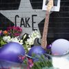A photo of Prince is held up by a guitar leaning against First Avenue, the nightclub where U.S. music superstar Prince got his start in Minneapolis Minnesota