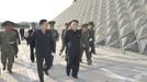 North Korean leader Kim Jong-Un (front C) inspects the construction site of the Munsu Swimming Complex, which is nearing completion, in this undated photo released by Nor