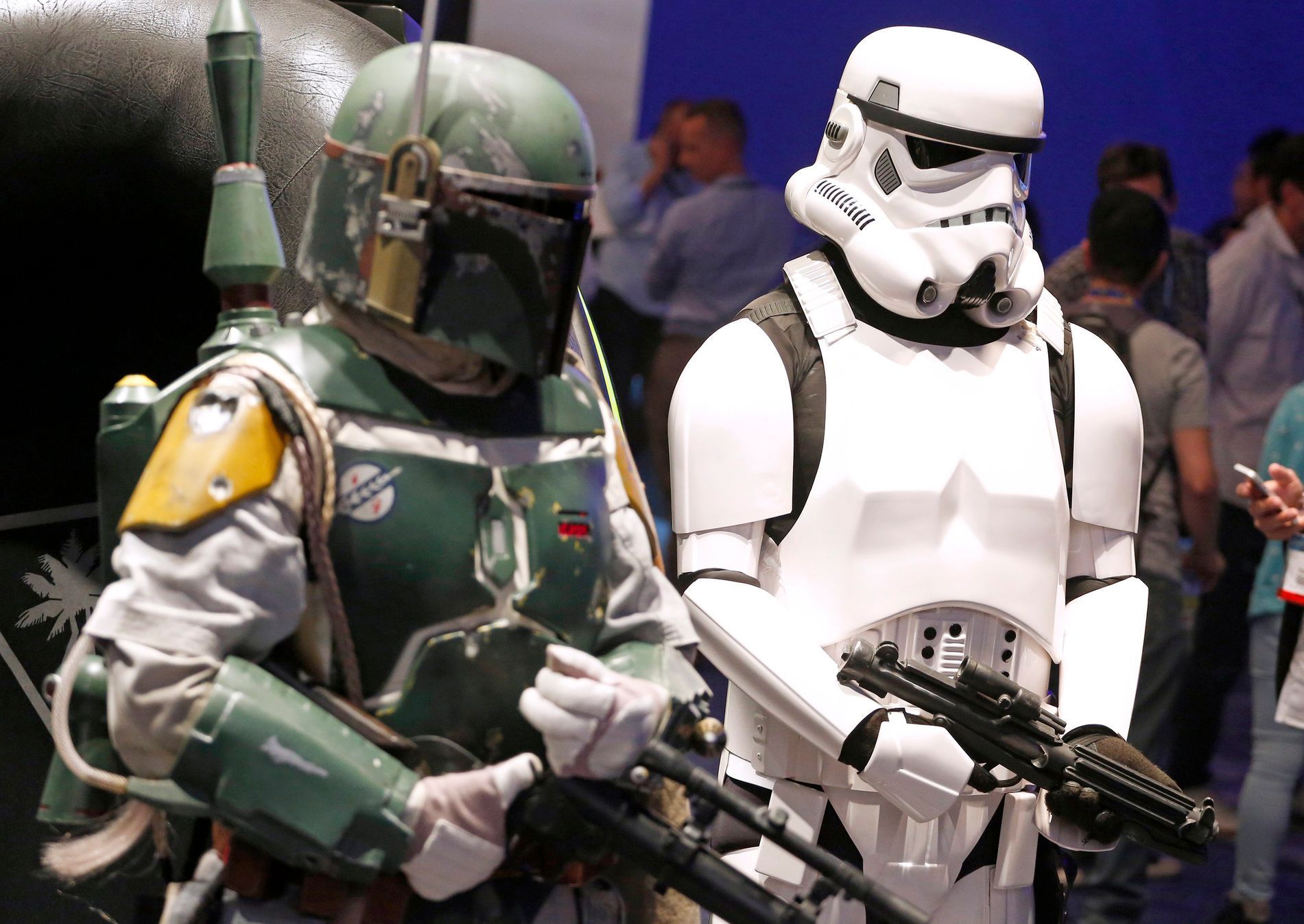 People dressed as &quot;Star Wars&quot; characters Boba Fett (L) and a Stormtrooper pose at the 2014 Electronic Entertainment Expo, known as E3, in Los Angeles