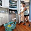 Michelle Stober, of Cary, N.C., removes food from a freezer as she prepares their vacation home in advance of Hurricane Florence in Wrightsville Beach, N.C.