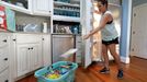 Michelle Stober, of Cary, N.C., removes food from a freezer as she prepares their vacation home in advance of Hurricane Florence in Wrightsville Beach, N.C.