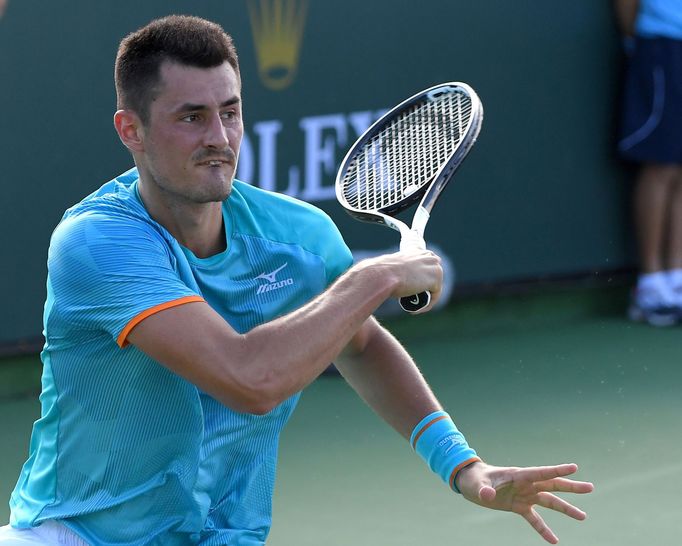 FILE PHOTO: Mar 5, 2019; Indian Wells, CA, USA; Bernard Tomic (AUS) hits a shot during his first round qualifying match against Lucas Rosol (not pictured) in the BNP Pari