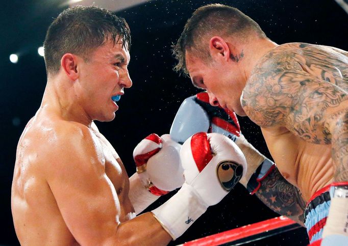 World champion Gennadiy Golovkin of Kazakhstan (L) punches Martin Murray of England during the WBA-WBC-IBO Middleweight World Championship in Monte Carlo, early February