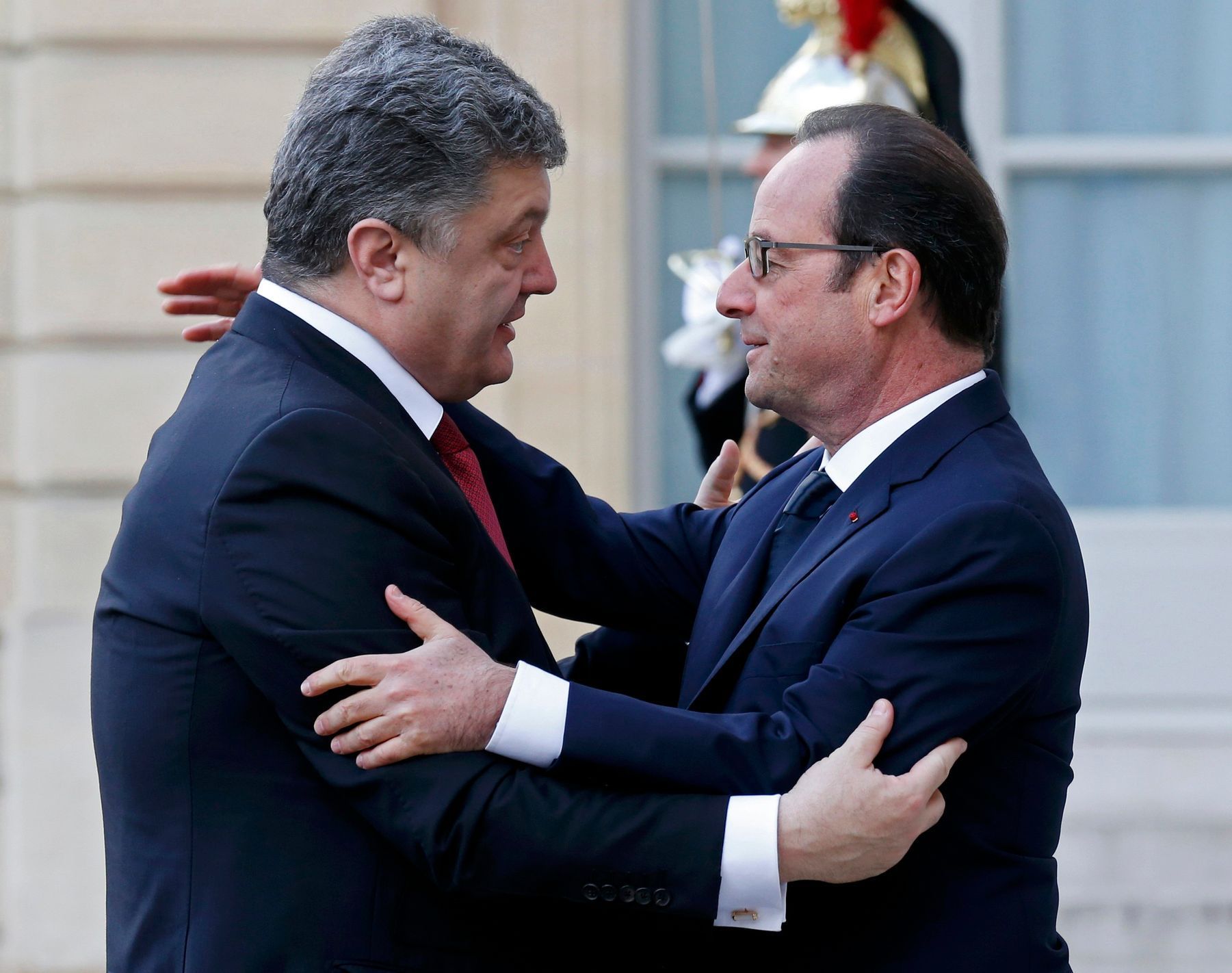 French President Francois Hollande welcomes Ukrainian President Petro Poroshenko at the Elysee Palace before attending a solidarity march in the streets of Paris