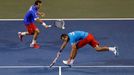 Czech Republic's Stepanek hits a return beside his compatriot Rosol during their Davis Cup quarter-final men's doubles tennis match against Japan's Ito and Uchiyama in To