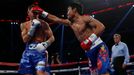 Manny Pacquiao (R) of the Philippines punches Chris Algieri of the U.S. during their World Boxing Organisation (WBO) 12-round welterweight title fight at the Venetian Mac